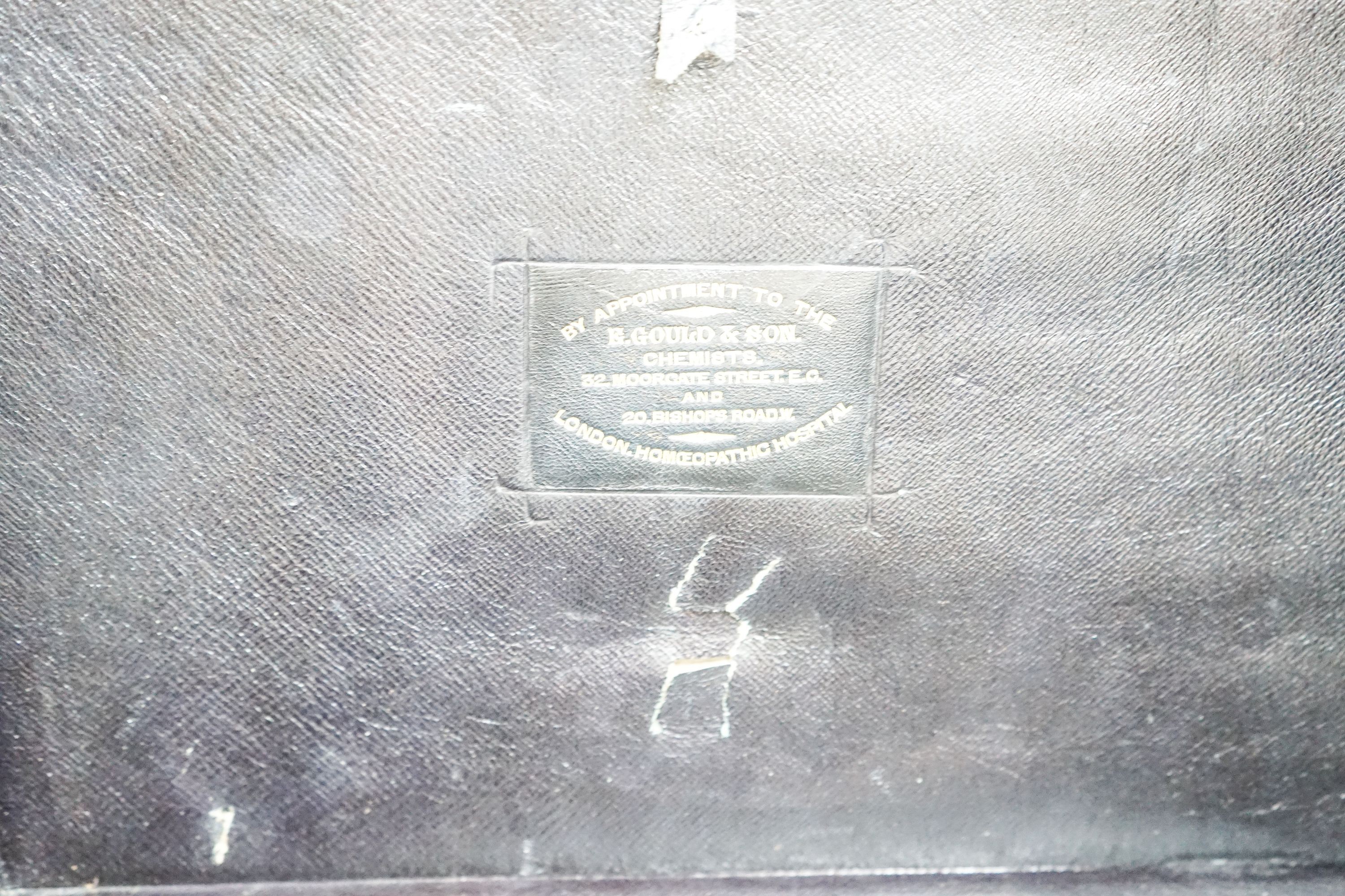 A late 19th/early 20th century brass mounted burr walnut box, label to interior reading ‘E.Gould & Son. Chemists. 32. Moorgate street. E.C. And 20 Bishops road. W. By appointment to the London Homeopathic Hospital.’